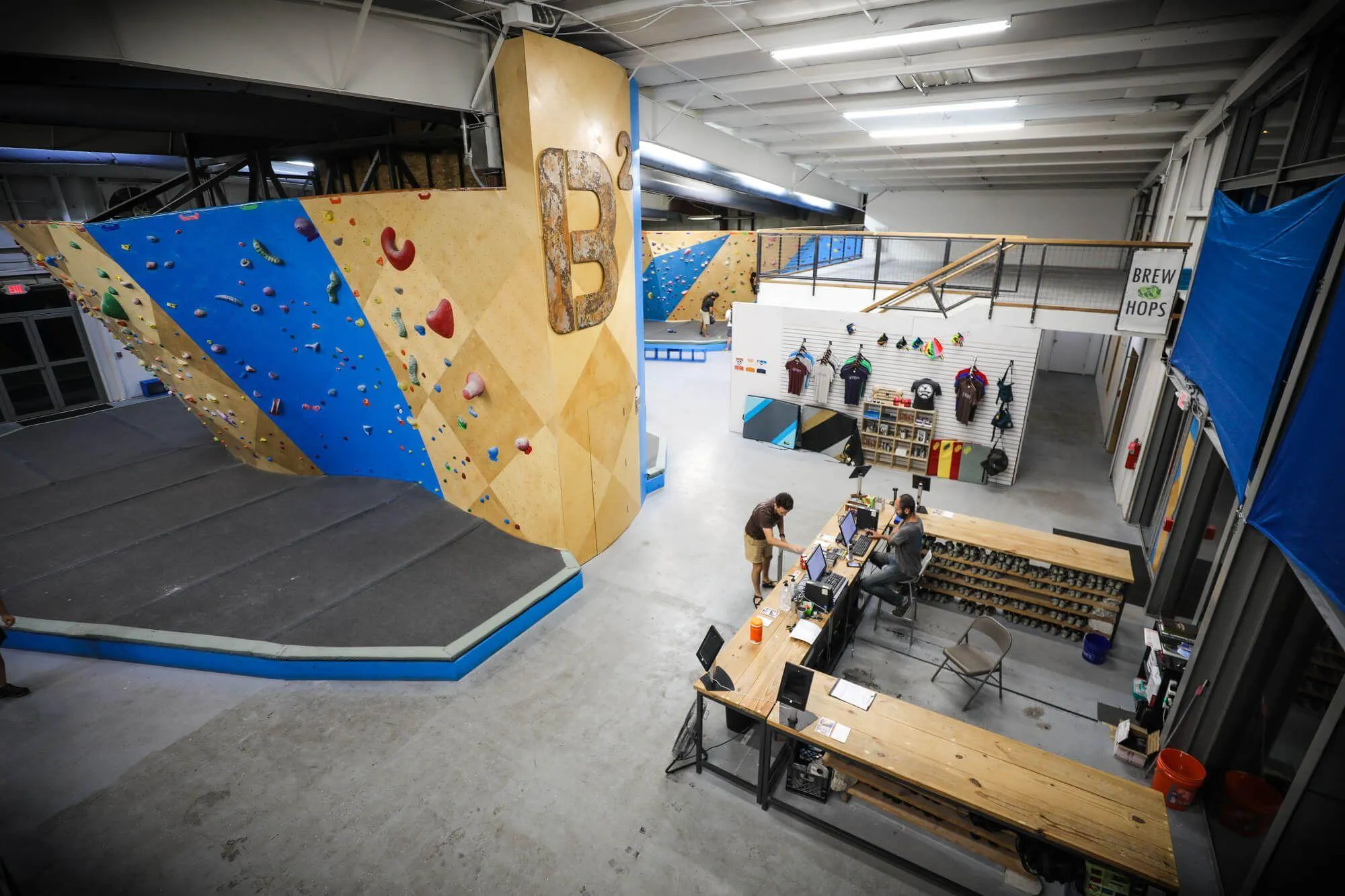 The south-facing side of the Center Boulder with both Shovel and Comp walls, are immediately to climbers left as you check-in at the front desk.