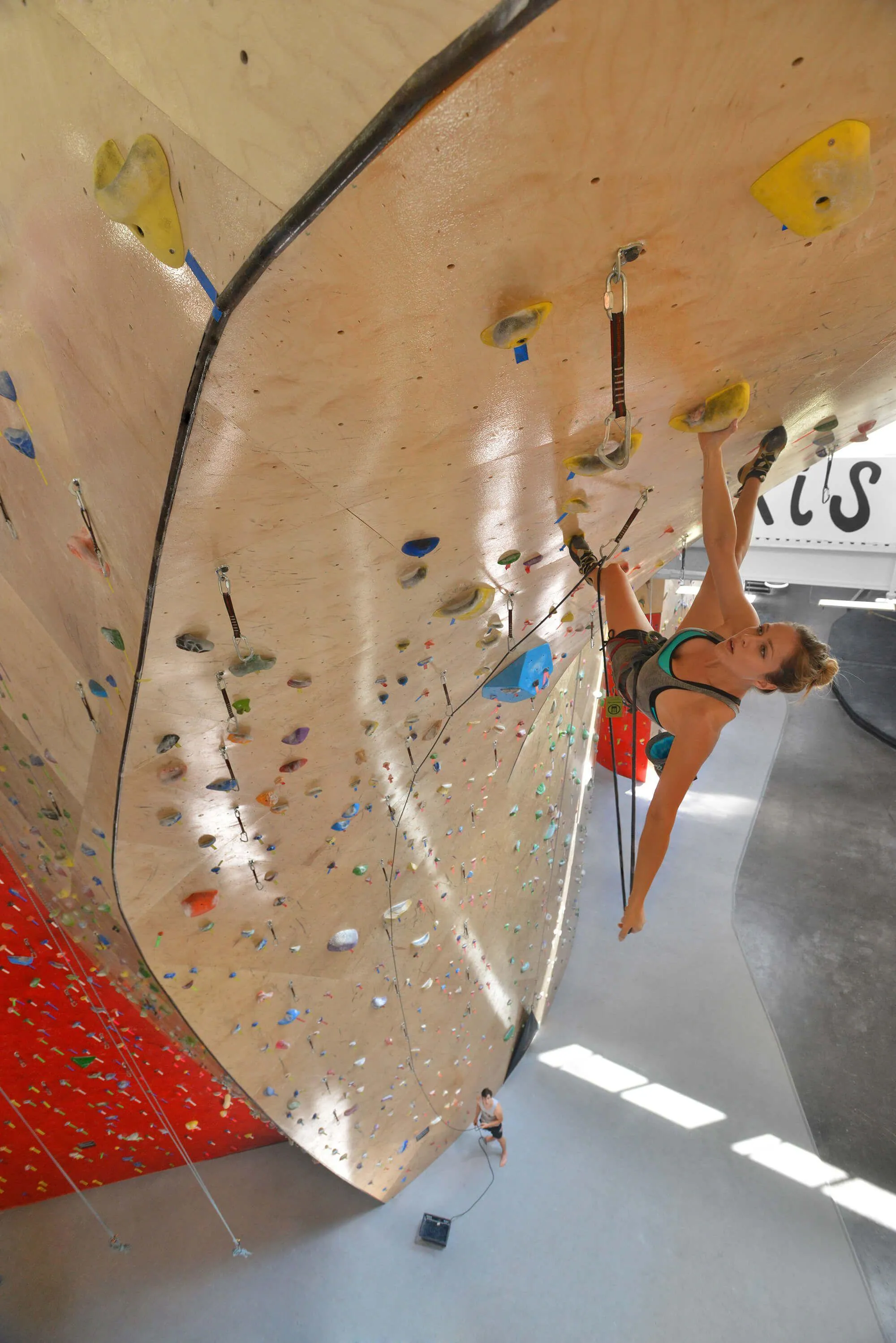 A view not many will experience, the overhung moves at the top of the “tongue” feature are super fun, and the design as a whole gives the rope-climbing walls a focal point.