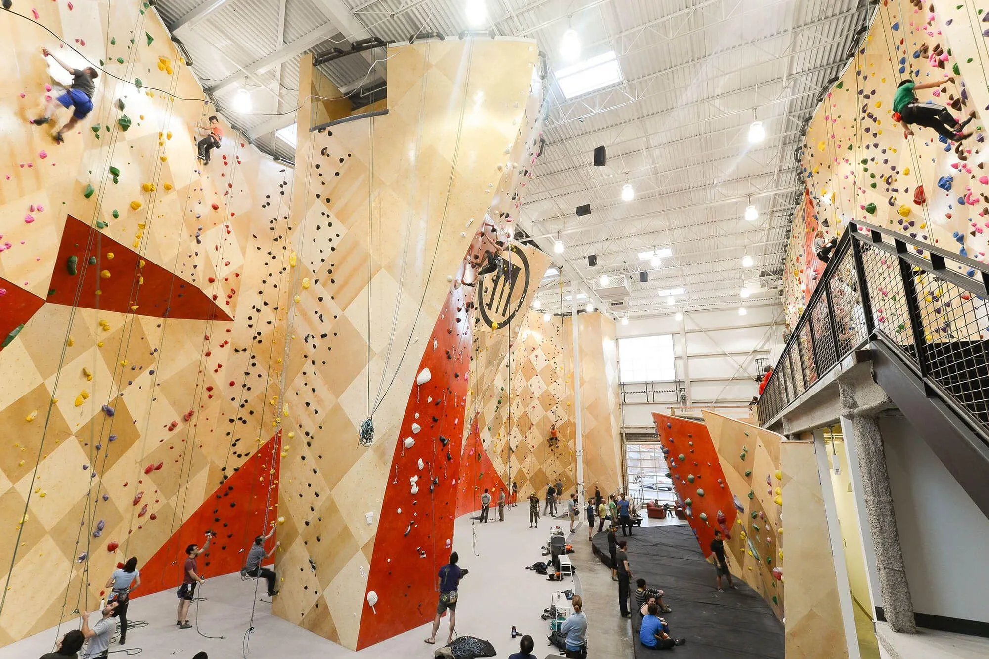 This wide-angle shot shows a large section of the main climbing area, complete with BKB super-large logo and brand-specific red wall stains to accentuate the climbing wall design features.