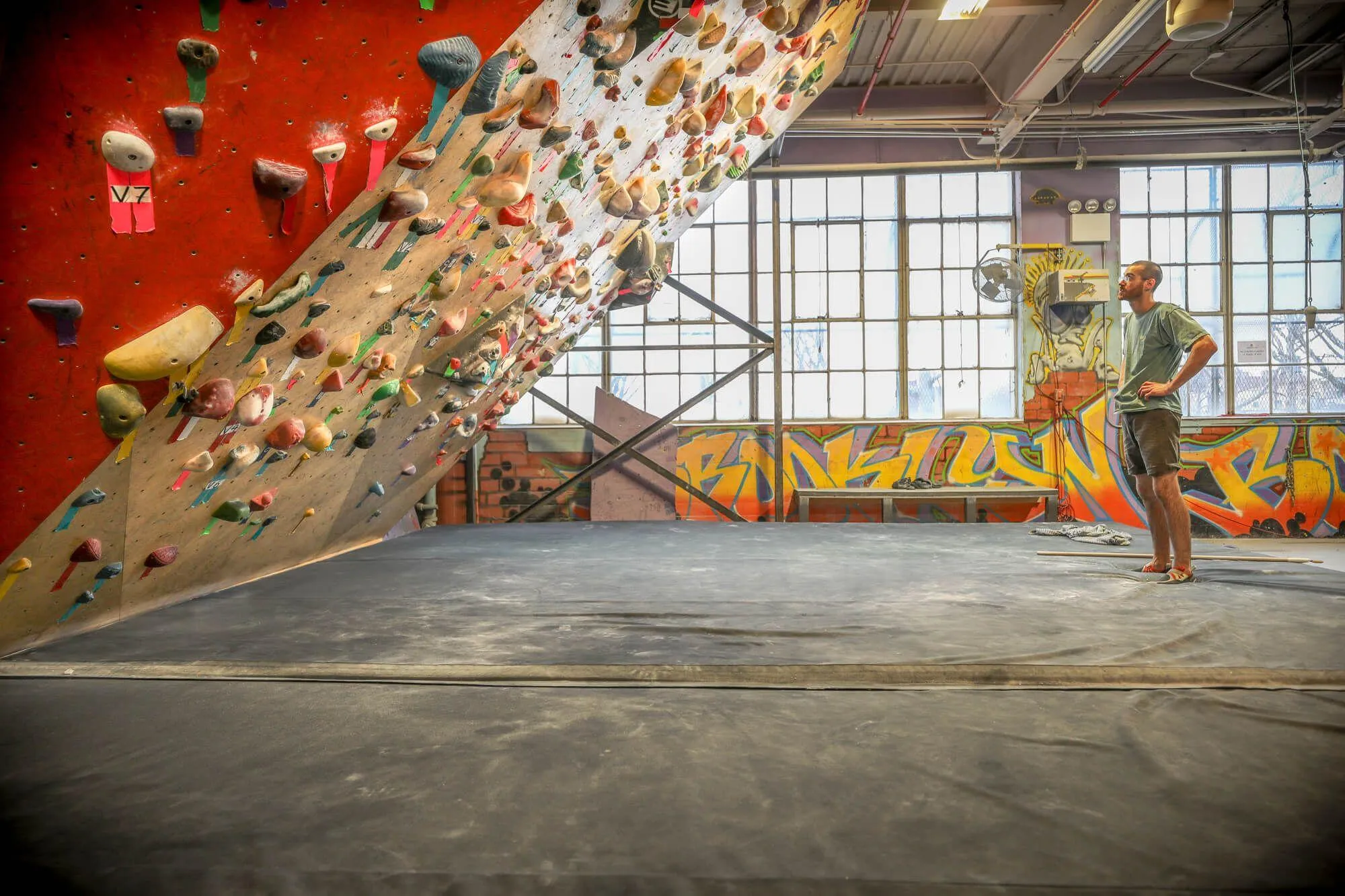 A favorite feature amongst BKB's dedicated bouldering climbers, this high-angle wall creates an intimidating challenge, regardless of the route difficulty. From this angle you can see how custom paint, be it on climbing walls or brick walls, was important to the BKB brand.