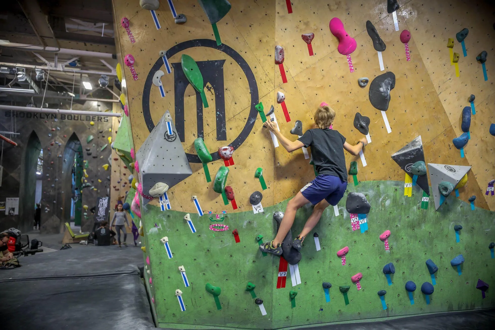 The first climbing wall you are greeted with upon entering, BKB made sure to have their branding heavily integrated on walls, volumes, and within design features.