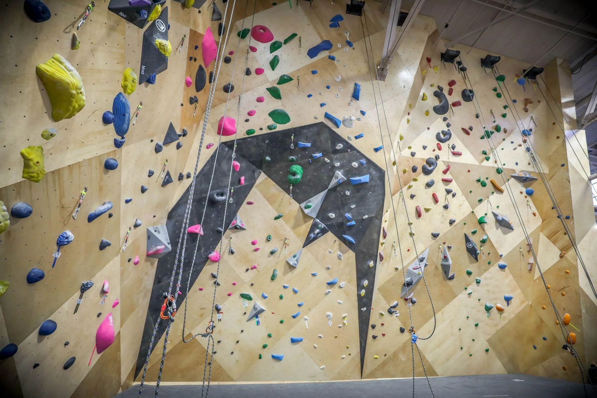 A great example of what is possible for existing gyms that need renovations: This entire roped climbing area project was conceived, designed, manufactured, and installed in a total of nine weeks by Vertical Solutions and the BKB team. Not to mention this included the time it took to demo the original owner-built climbing walls.