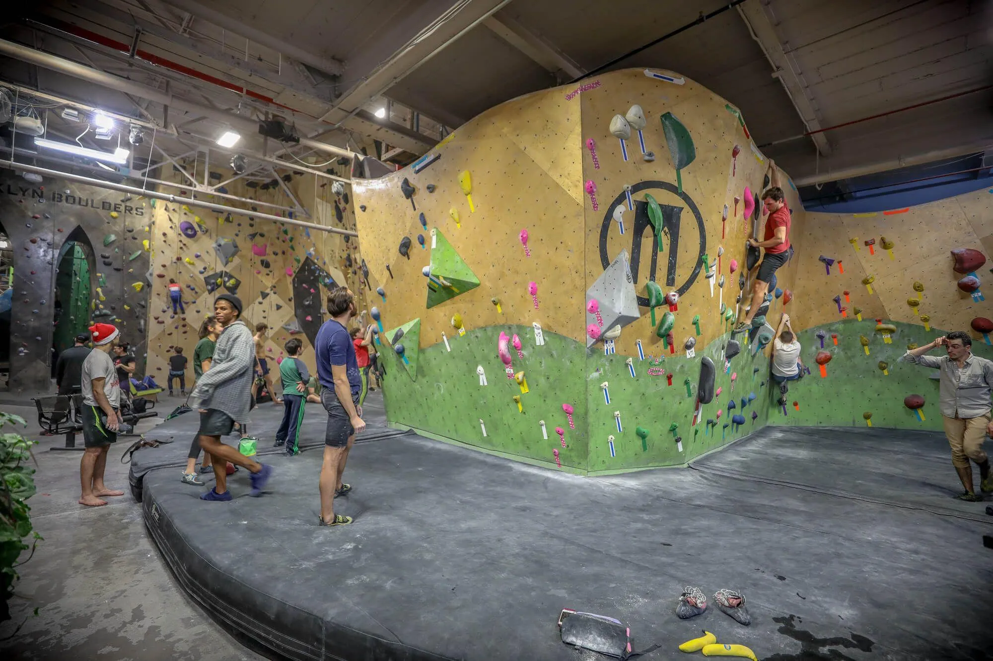 Another view of the entry bouldering peninsula built from both MLM and ARC climbing wall styles, and the Habit Flooring system that protects climbers from injuries.