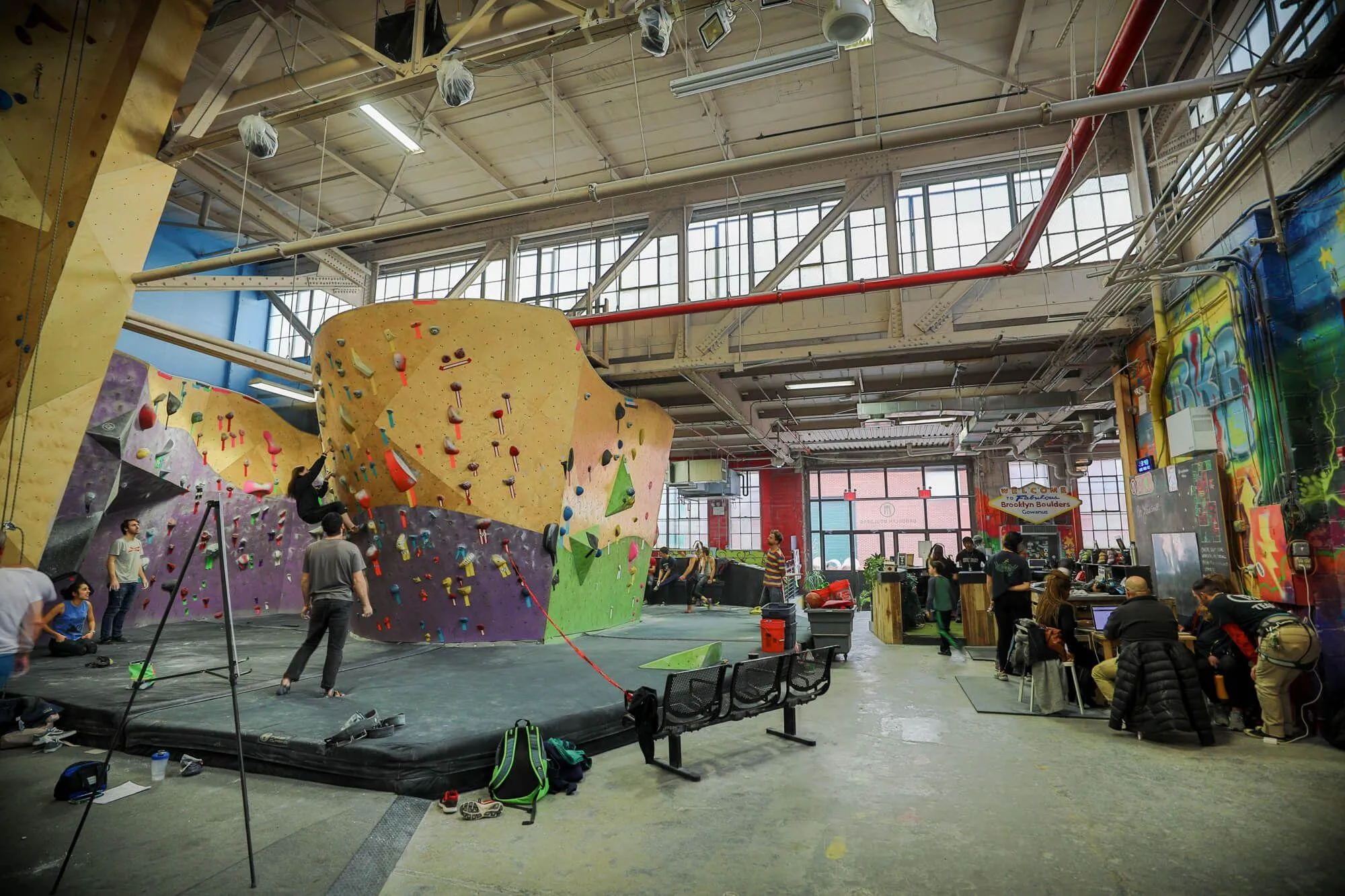 A wider view of the first of many bouldering areas, front entrance, and front desk area of the massive BKB facility in the Gowanus neighborhood of Brooklyn. The building has great natural light features that keep it well lit throughout the day.