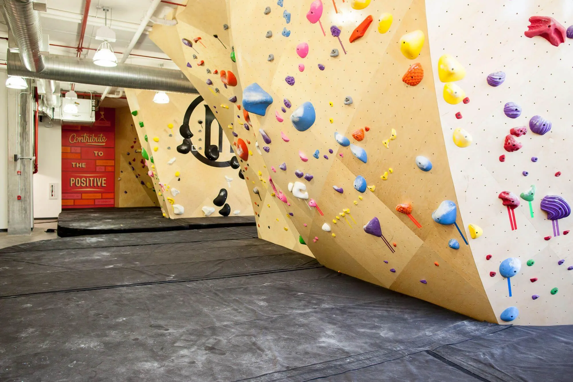 From this perspective, you can see just how complex of a floor plan and climbing wall plan the Queensbridge location had to have in order to maximize climbing area at the bottom of a NYC high-rise building. Lots of climbing areas separated by pathways connecting them all.