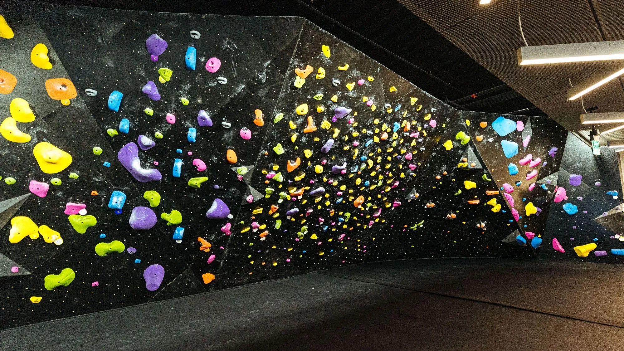 These edgy black bouldering walls match the rest of the BKBX's one-of-a-kind space perfectly.