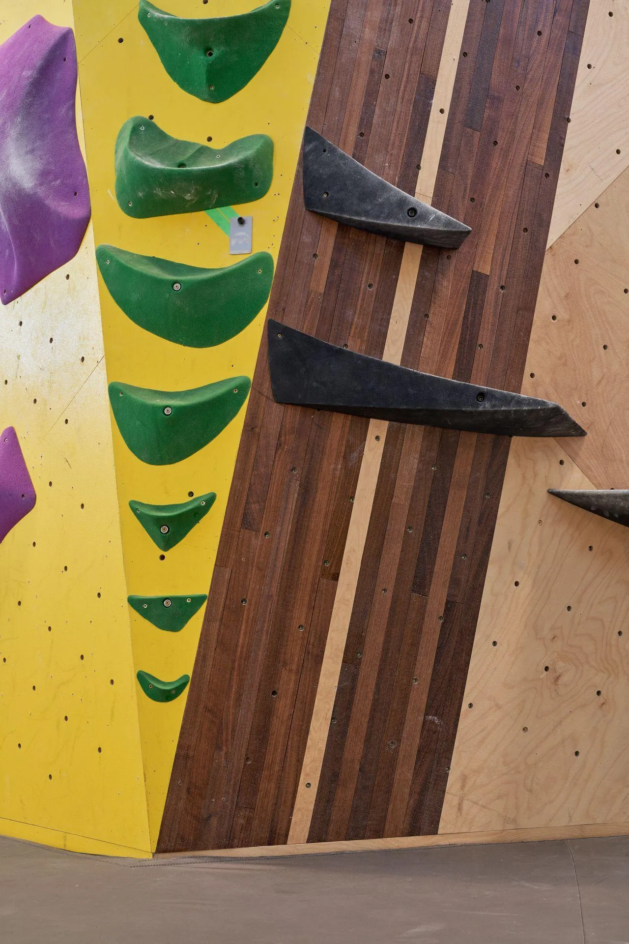 The walls at Crux are a masterful mix of bold brand colors and Vertical Solution's gorgeous inlaid wood details, mixing energy and style.