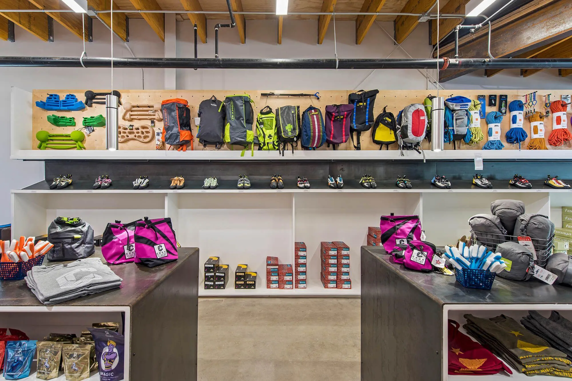 A detailed view of the shoe and bag retail area which aims to entice customers into checking out the latest gear. Lots of space, and lots of options for customers to geek out on.