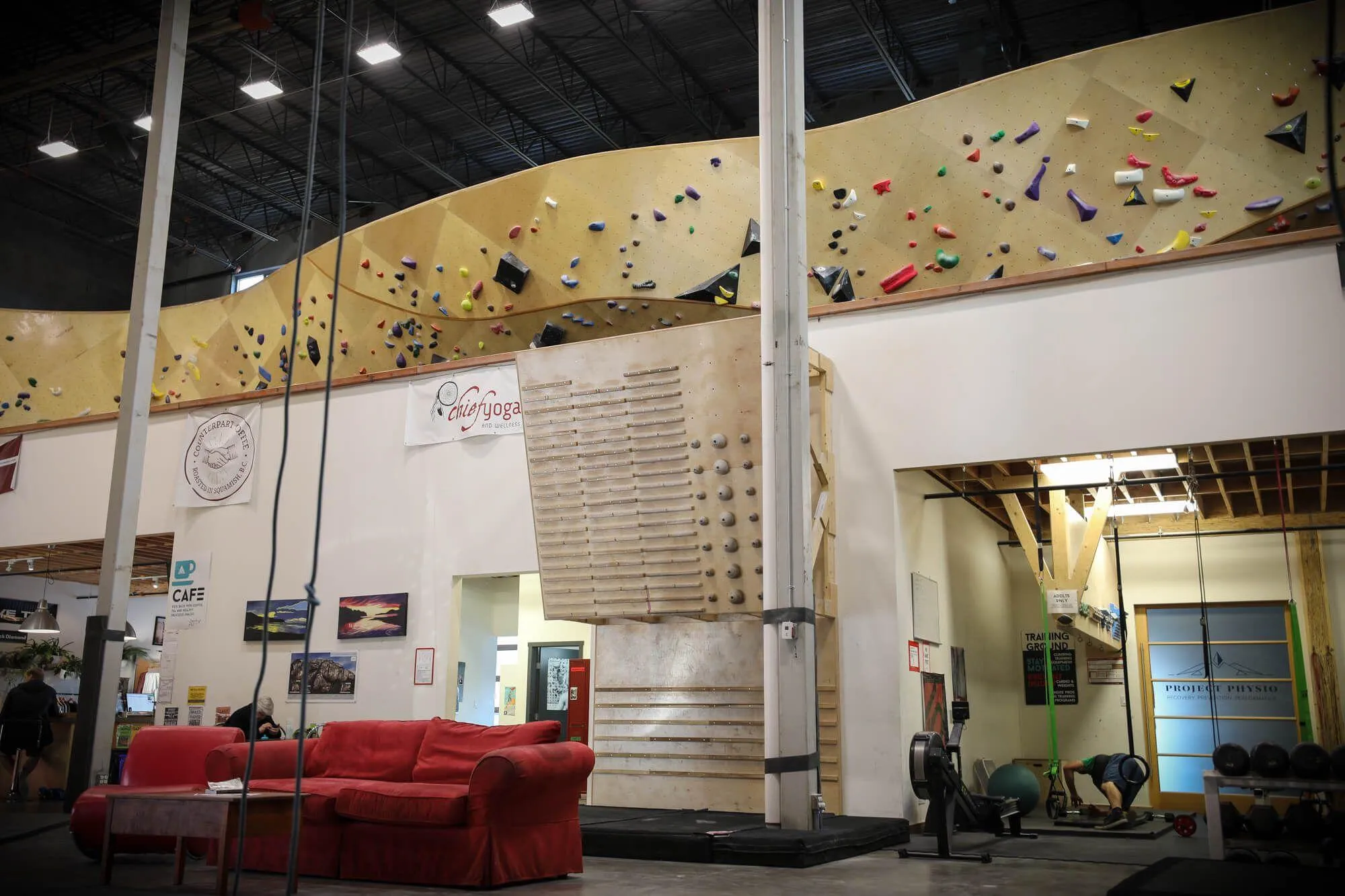 When their customers take a break from sending inside or out, they head here to train using a number of different tools and methods. Or ya know, just hang out during a rainy day drinking espresso on one of their comfy iconic red couches.