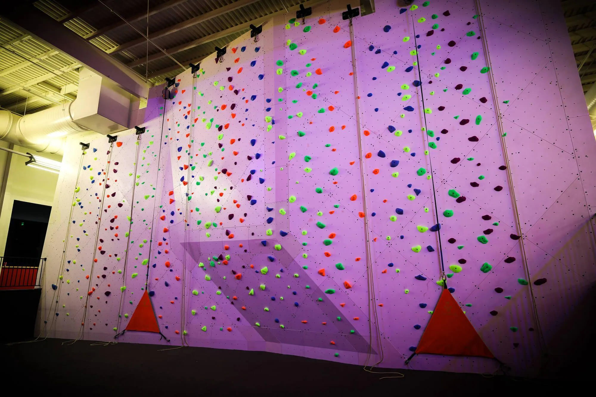 This project really defined our ability to execute on a client's vision outside of the typical usage we come across. The paints, textures and blacklight coatings on our walls in this project expanded our repertoire just that much further. Getting our products to look great in the daylight and under blacklight was a fun problem to solve.