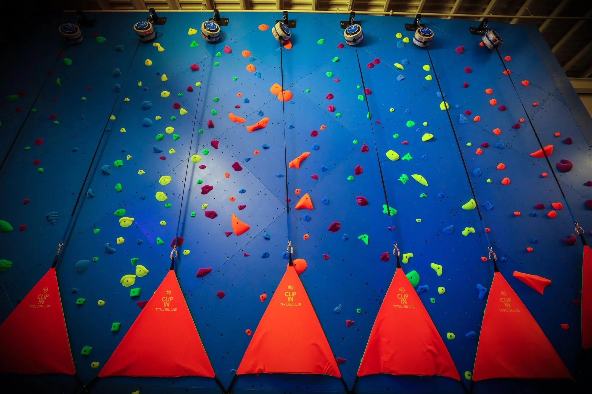 Throughout the 4,000 sq.ft. of roped climbing walls, you will find TruBlue Auto Belays ready to assist climbers. As this is a facility for kids, we opted to package many of these with our own custom Auto Belay mounts, together with all of the walls and flooring to keep costs low for our clients.