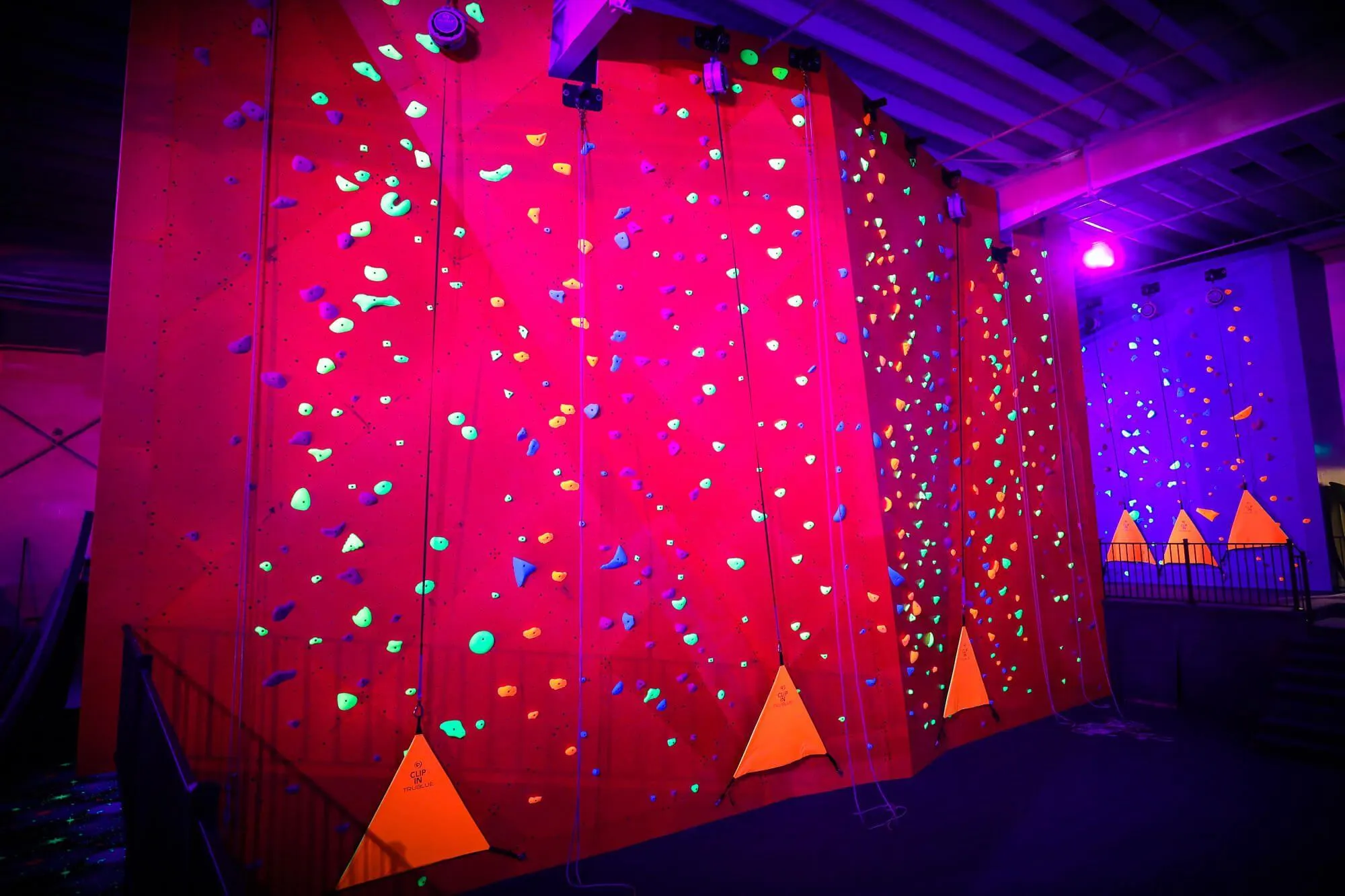 Another view of the walls and how they react under blacklight, together with the specially-formulated climbing holds that really pop for an awesome appearance.