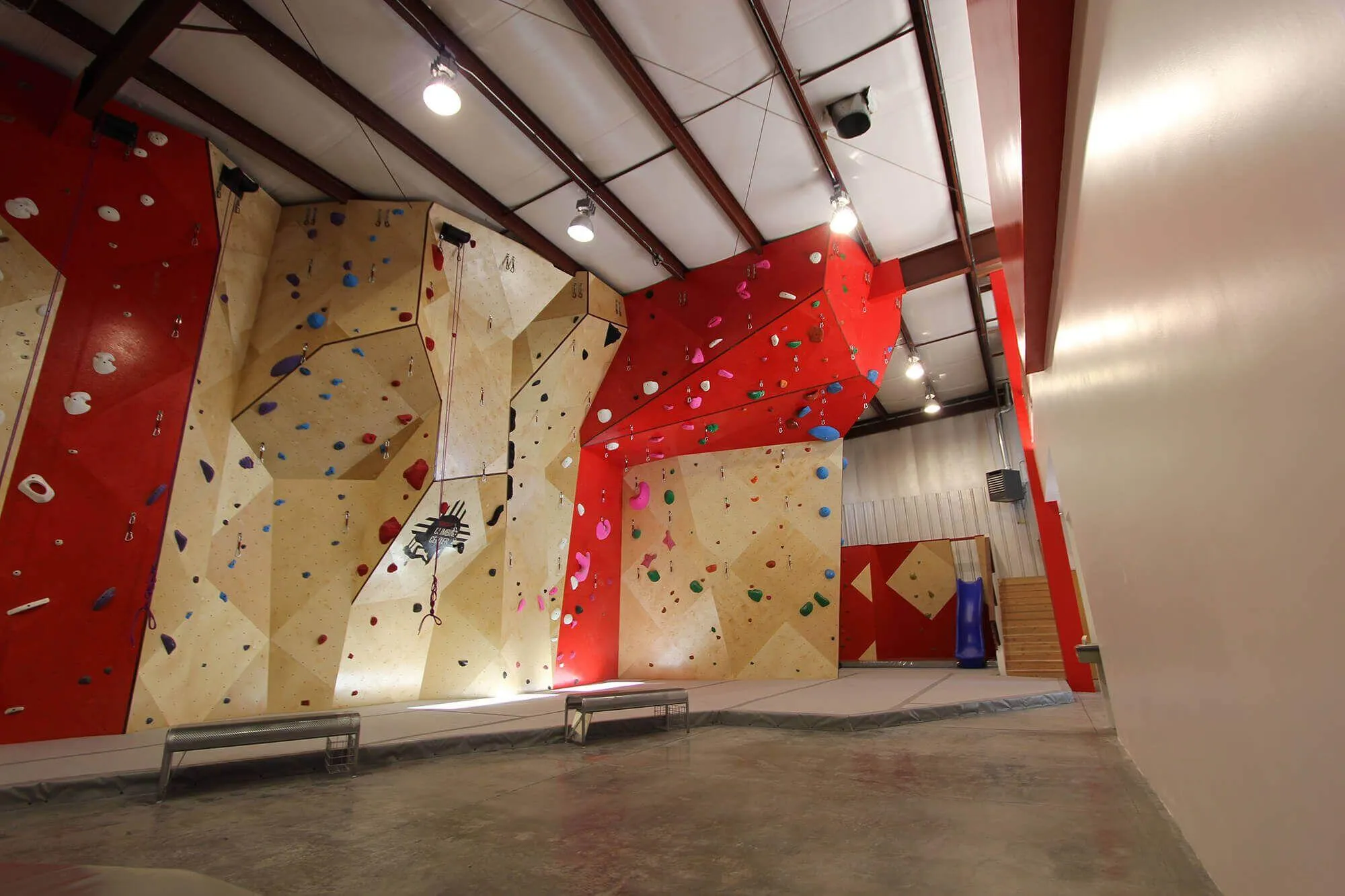 Taking a step back, you can see how intimidating the overhung lead climbing wall is at this indoor climbing gym. This specific design feature is something Vertical Solutions can execute on quickly using the advantages of our MLM process and CNC cut geometric panels.
