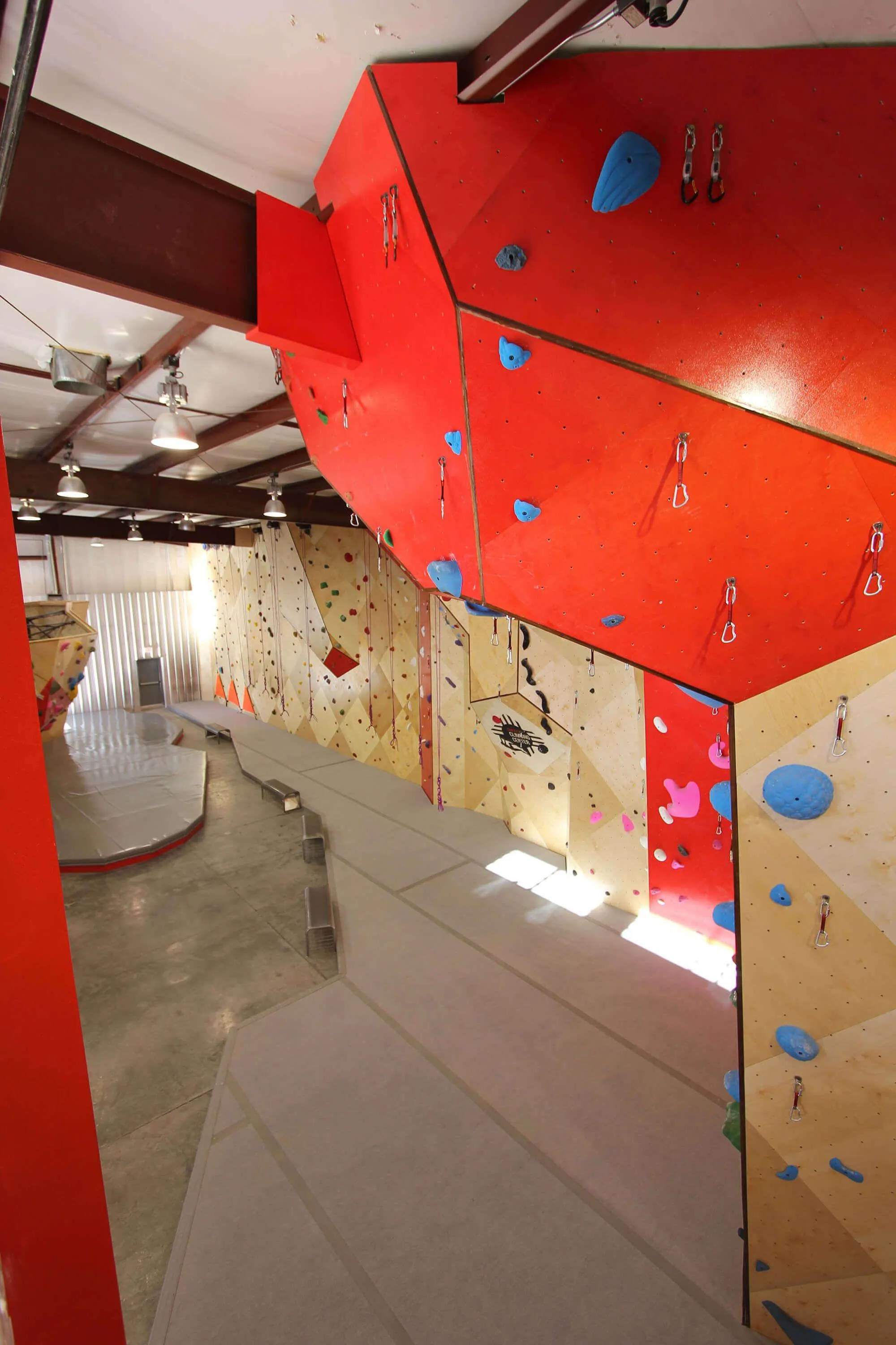 This view shows almost the entire single-sided rope climbing layout of climbing gym. Vertical Solutions manufactured these indoor climbing walls to deliver a great climbing experience now, and decades down the road.