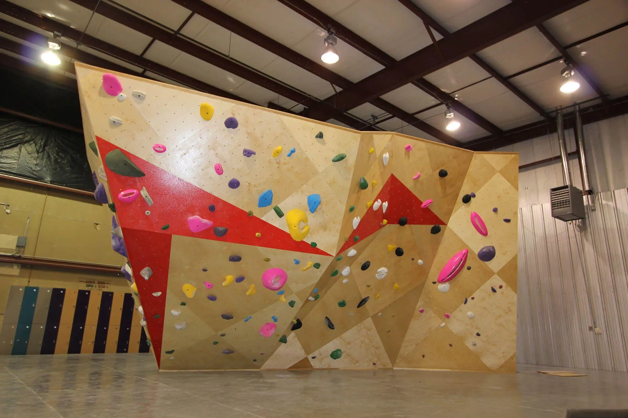 A close view of the indoor bouldering island wall system that adds a bunch of indoor climbing square footage for their customers. On the back side is an oversized garage door that gets opened up on nice days to let the sun and fresh air enter the climbing gym.