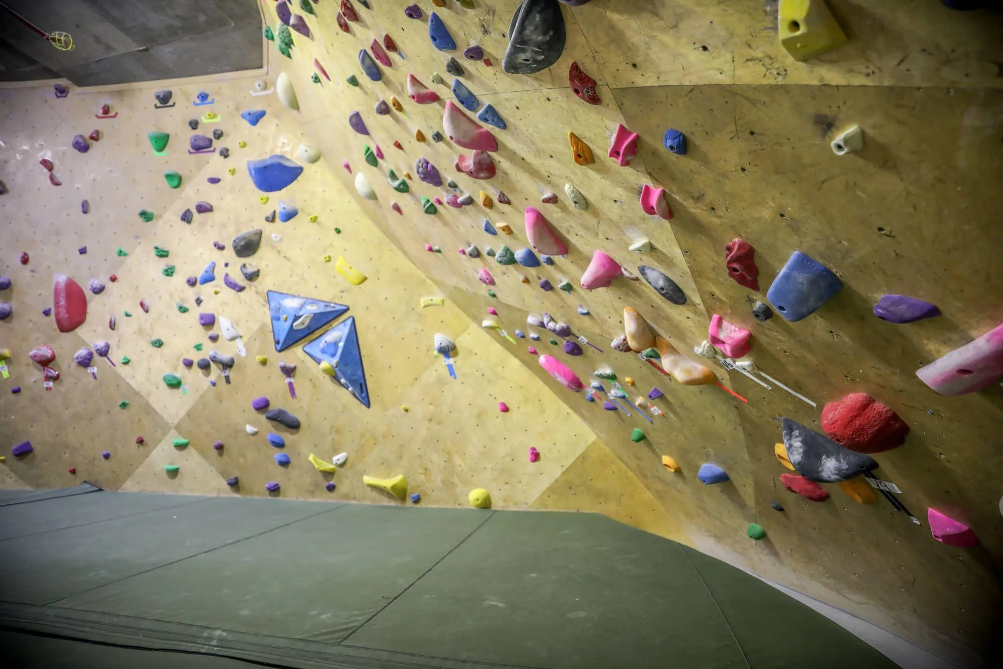 With not a ton of room for deep overhanging walls due to the thin nature of the floor plan, this super-steep cave was designed in the rear of the facility to give an extra challenge to those who were fit for it.