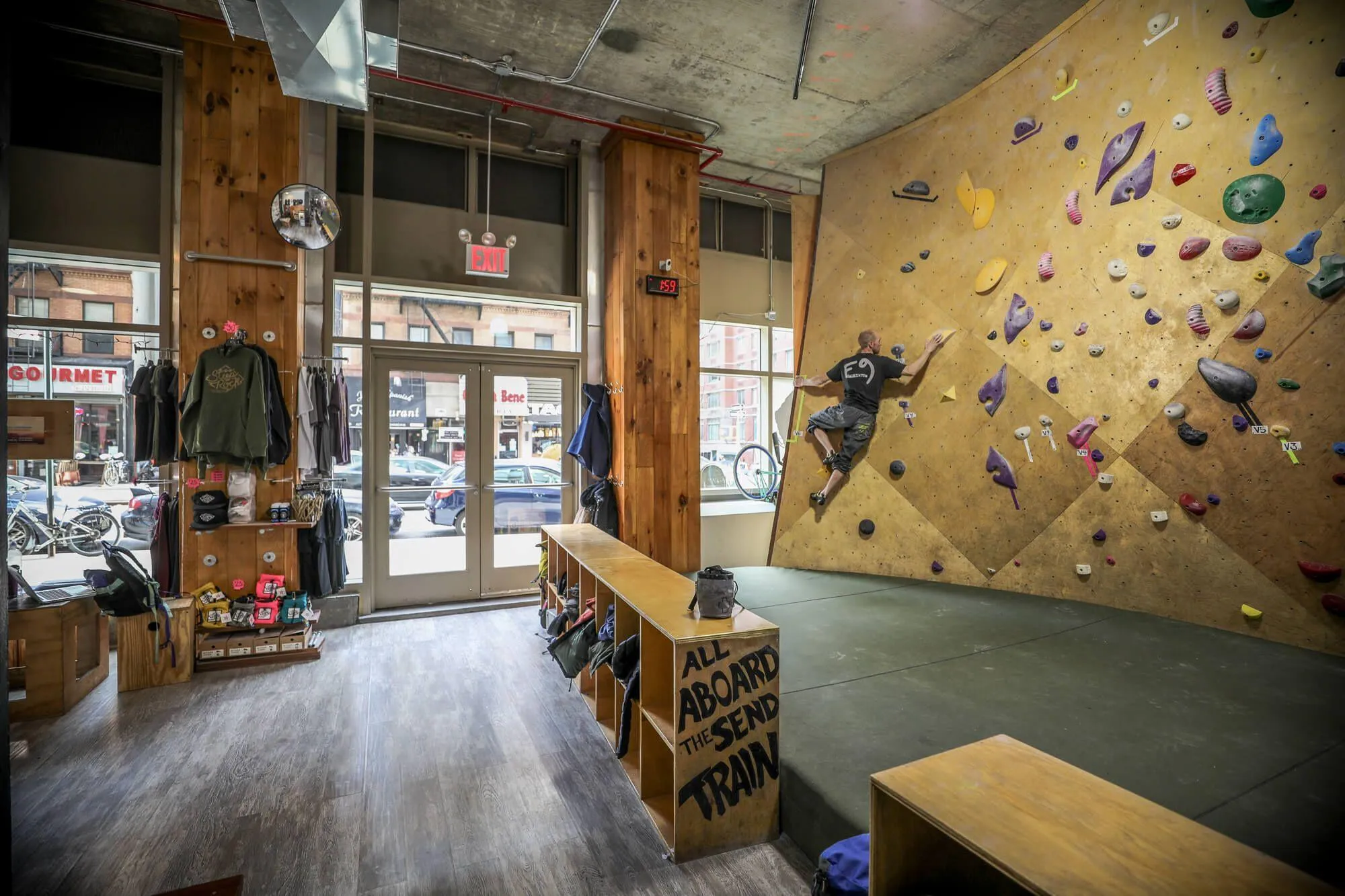 Every inch of this awesome facility was well thought-out, including the introduction of these useful benches that serve as a resting space as well as storage for client's belongings while they are on the wall.