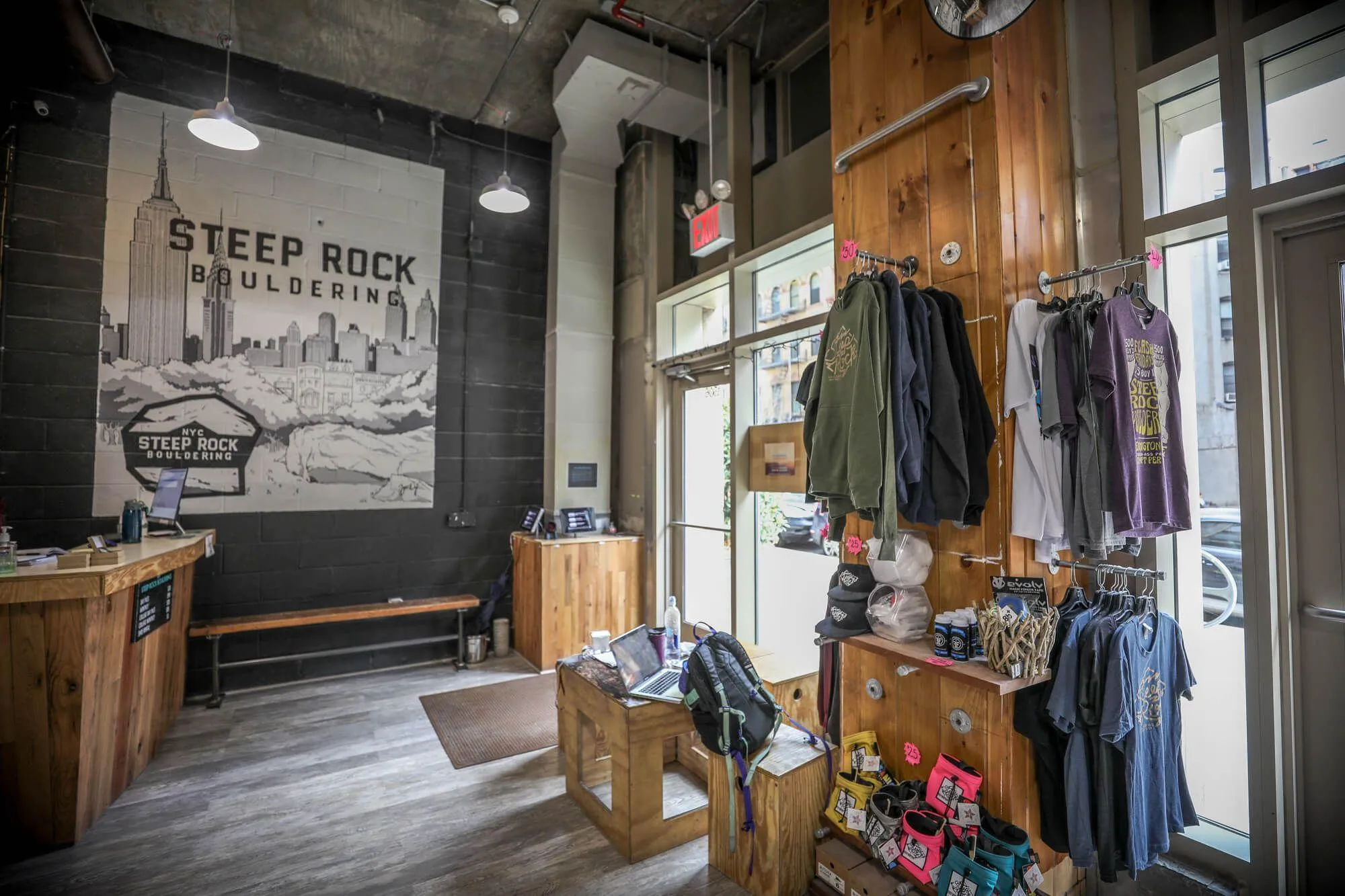 A view of the front entrance looking out towards the street. The small merchandise area provides supplementarity profit while not being obtrusive to customers wanting to head straight to climbing.