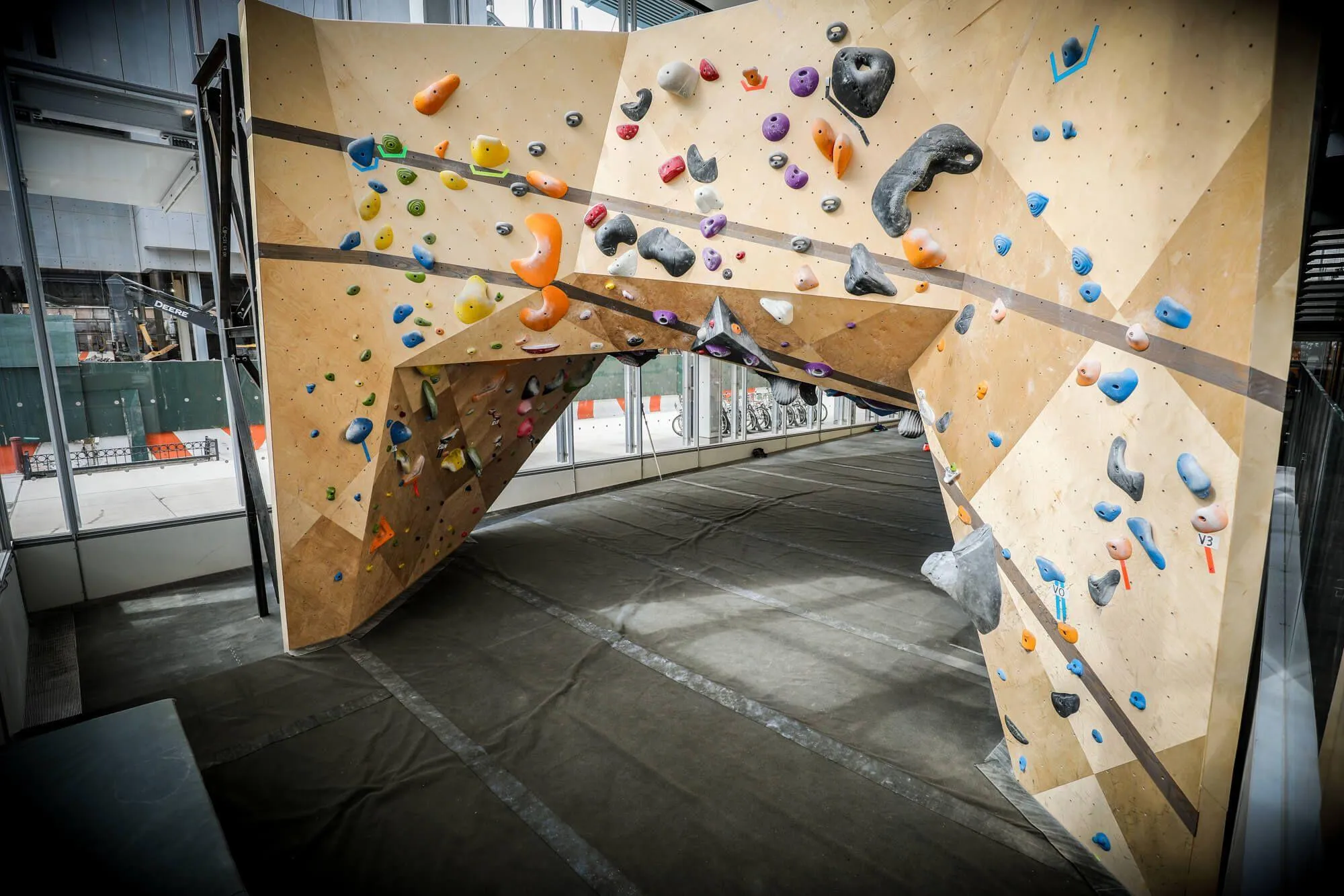 A backside view of the immense cave featured on the ground floor of bouldering. As with the main side, intricate and seamless hardwood features were carried through.