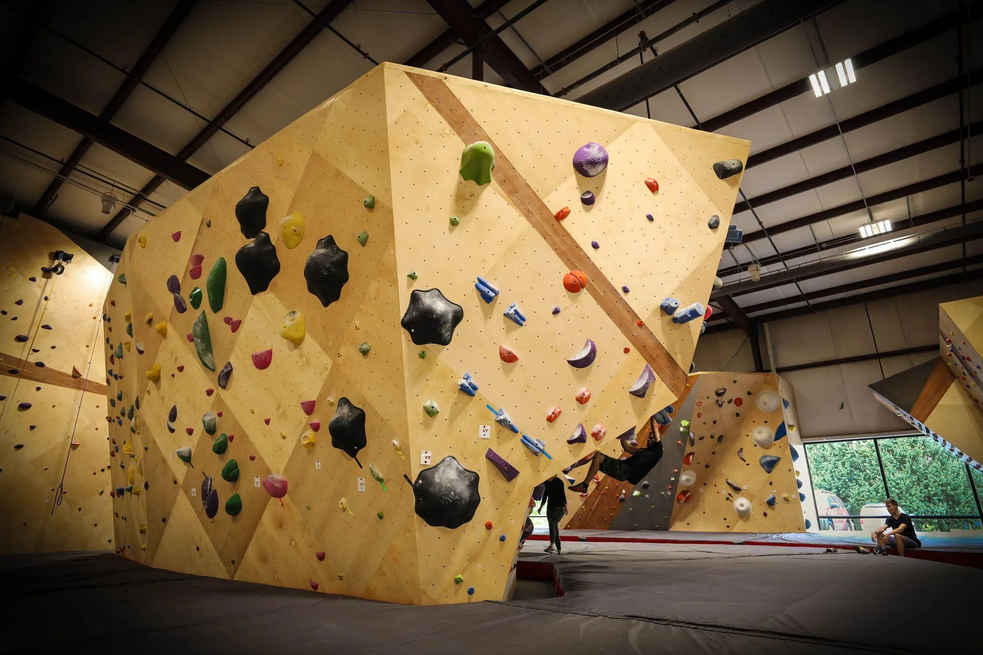 To match the ultra-clean and cohesive look of the entire facility, the owner decided to go with all Habit Flooring throughout the gym for both route and bouldering as seen here. No other flooring met the requirements for safety, cleanability and aesthetics.