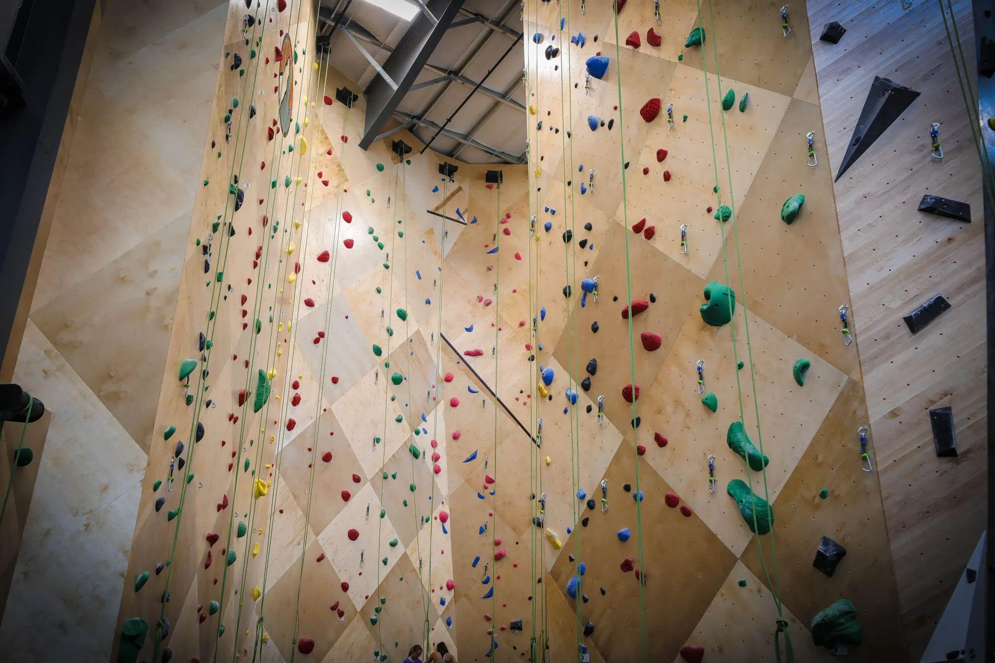 The first walls you are greeted with, these tall route walls are of MLM geometric designs where tied into the building's exterior structure, and ARC curved design where freestanding.